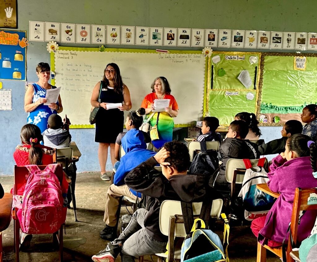 Diana Chia and two volunteers of GFWC Florida teaching about hygiene at a school in Belize, 2024