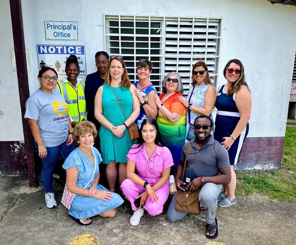 Laurence with the 2024 GFWC team volunteers with school admin in Belize